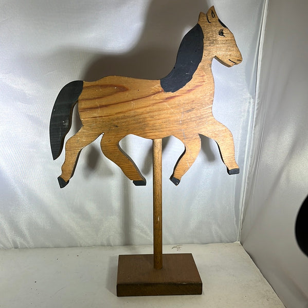 Carved folk art horse on stand